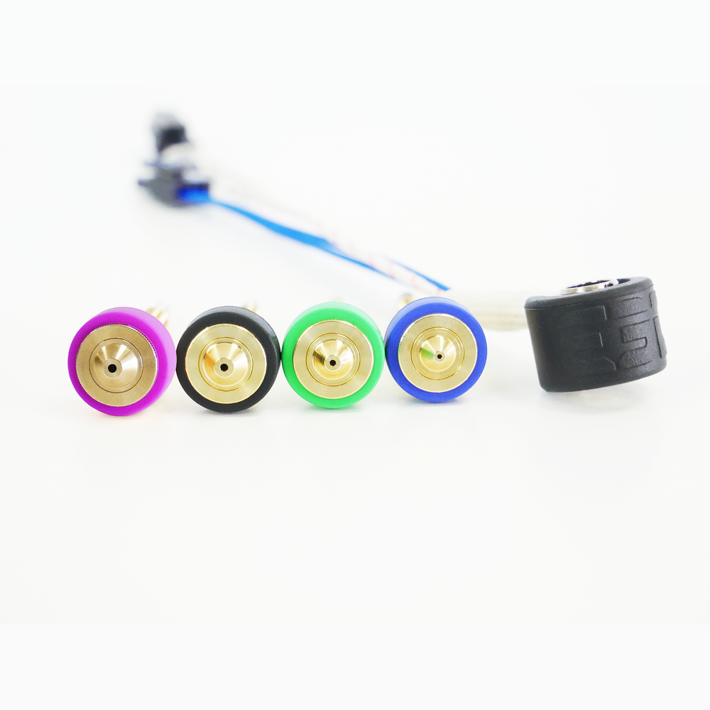 Four E3D Revo High Flow brass nozzles with socks next to a 60 W HeaterCore