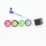 Four E3D Revo High Flow brass nozzles with socks next to a 60 W HeaterCore