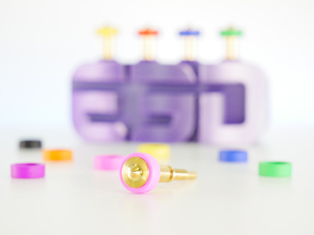 E3D Revo brass nozzle with loose colour-coded socks and E3D logo